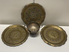 A selection of Indian brass wall hanging chargers and a silver plated bowl shipping unavailable