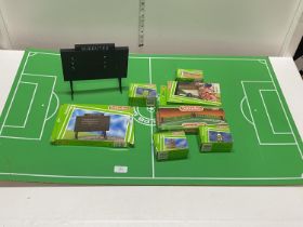 A selection of Subbuteo accessories including a hardboard pitch, shipping unavailable