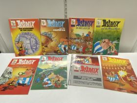 Nine collectable Asterix comic books