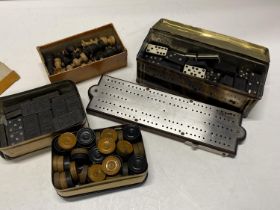 A selection of vintage wooden dominoes, draughts and chess pieces etc