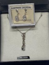 A pair of 925 silver earrings and a 925 silver chain and pendant