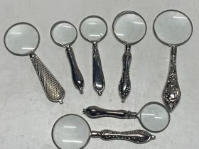 Seven assorted magnifying glasses