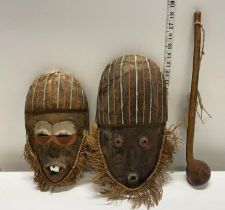 Two antique African wooden face masks and a African Knobkerrie