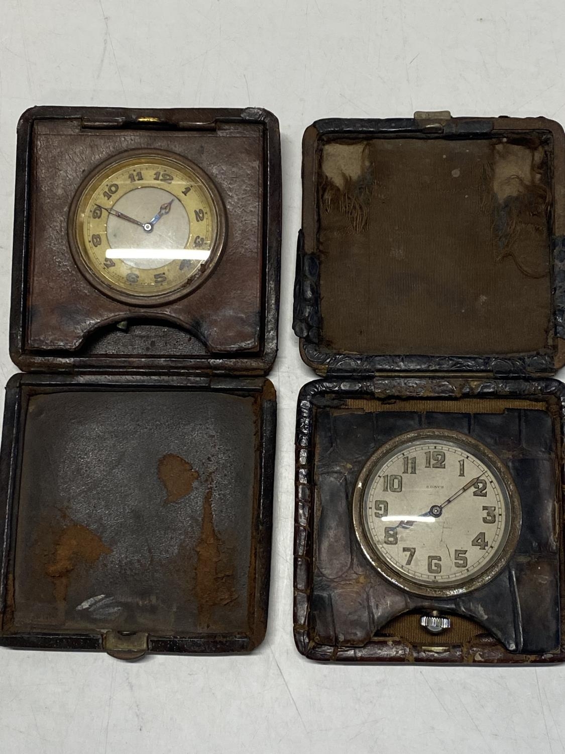 Two vintage stop watches in travel cases a/f