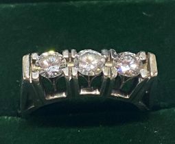 A 18ct gold and three stone diamond ring with round brilliant cut diamonds approx over 1ct of
