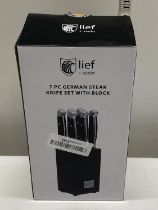 A New boxed German made seven piece steak knife set with block