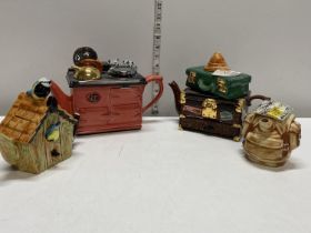 Four assorted collectable Swineside Teapottery tea pots