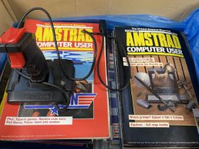 A job lot of vintage Amstrad computer user magazines and joystick