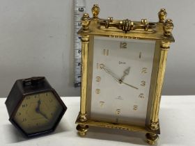 A vintage Swiza carriage clock and a 1930's miniature alarm clock