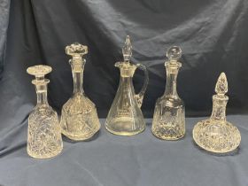 Five assorted cut glass decanters