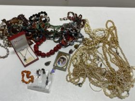 A selection of assorted costume jewellery and simulated pearl necklaces