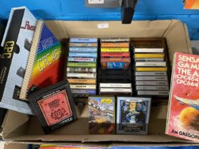 A job lot of assorted cassette games for Amstrad and computer books etc