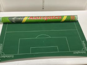 A Subbuteo astro turf pitch