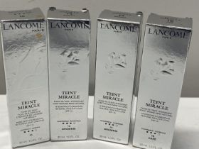 Four boxed Lancome Bare Skin Foundation
