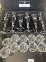 A box set of six Royal Doulton crystal glasses with applied decoration and ten smaller etched