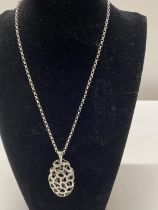 A 925 chain and white metal pendant