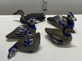 A selection of assorted duck figurines, mainly brass and enamel.