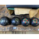 A set of vintage indoor bowls