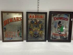 Three vintage advertising mirrors including Martini