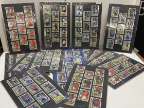 A selection of Merlin's premier stars mounted football cards