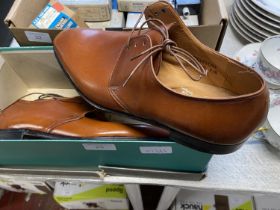 A pair of new handsewn brown leather shoes size 7