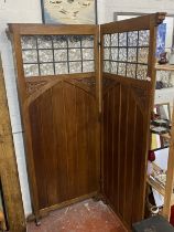 A antique clerics privacy screen with glazed and carved panels, shipping unavailable