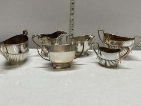 A selection of silver plated jugs and sugar bowls including James Dixson