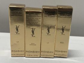 Four assorted Yves Saint Laurent cosmetic products