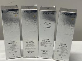 Four boxed Lancome Bare Skin Foundation