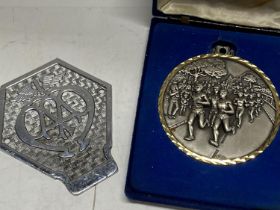 A large boxed medal and unusual AA members badge