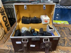 A case with a selection of assorted vintage camera accessories etc