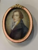 A early Victorian hand painted watercolour portrait on card in a gilt metal mount