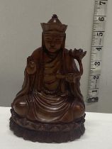 A hand carved wooden Budda figure