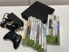 A XBOX 360 E with controllers and selection of games in working order