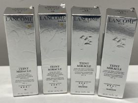 Four boxed Lancome Bare Skin Foundation