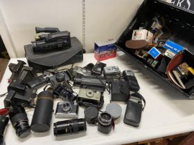 A large quantity of assorted camera's and accessories