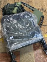 A as new fishing chair, one other chair and a fishing bag