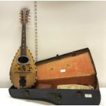 A early 20th century cased Marco Rebora mandolin with inlay detail