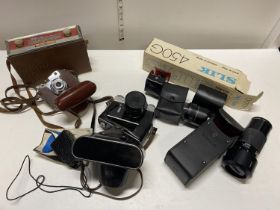 A job lot of vintage cameras, accessories and a Bush radio (untested)