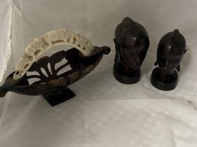 Two carved wooden African busts and a small wooden basket