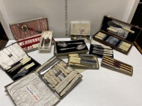 A large selection of vintage cased cutlery