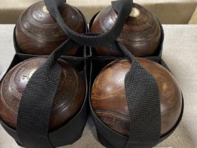 A set of four vintage lawn bowls