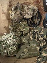 A helmet and military camouflage accessories including back pack etc