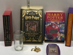 A selection of Harry Potter books and other Harry Potter items