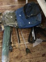 A job lot of assorted fishing tackle including nets and umbrella shipping unavailable