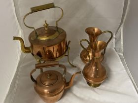 A selection of assorted copper wares including a spirit kettle