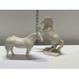 Two Beswick white horses