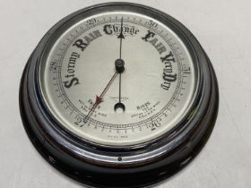 A vintage mahogany cased barometer