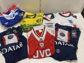 A job lot of assorted football shirts mainly new with tags.