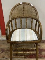 A quality oak handmade chair by Andy Thornton with cane back support and padded seat